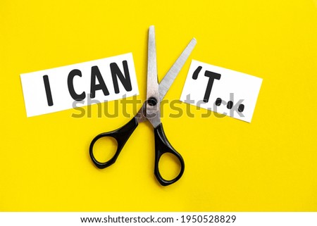 scissors cut the words i can not. concept believable. cuts the word un. I can, goal achievement, possible, potential, real overcoming. unpossible is believable. Royalty-Free Stock Photo #1950528829