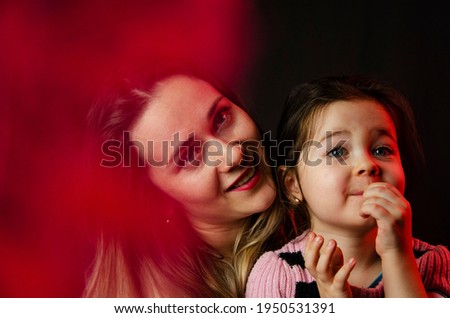 Smiling mother with her daughter. Happy mother with her baby. Portrait photo of mother and child. The concept of children and parents. Happy child hugs mother. Baby hugs. Mothers Day.