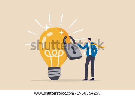 Intellectual property, patented protection, copyright reserved or product trademark that cannot copy concept, businessman owner standing with light bulb idea locked with padlock for patents. Royalty-Free Stock Photo #1950564259