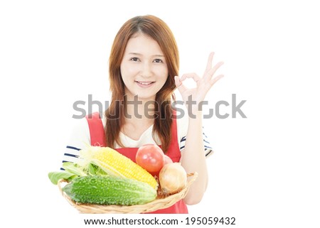 Smiling woman with vegetables