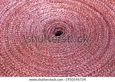 Copper mesh, twisted into a roll, top view.