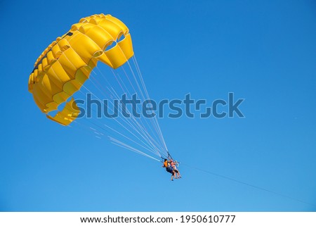 parachute in the sky, extreme rest, parasailing  Royalty-Free Stock Photo #1950610777