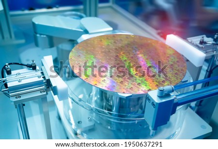 Silicon Wafers and Microcircuits with Automation system control application on automate robot arm Royalty-Free Stock Photo #1950637291