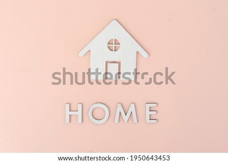 flat lay cut letters and home icon sign, view from above on table