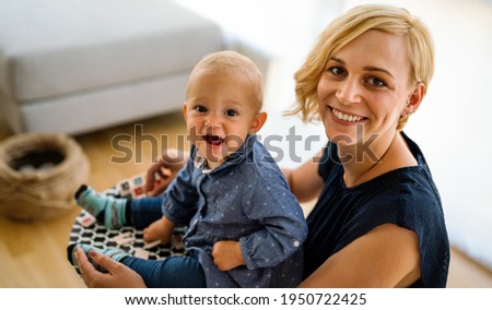 Happy mother with adorable toddler child. Family, parenting, childhood concept.