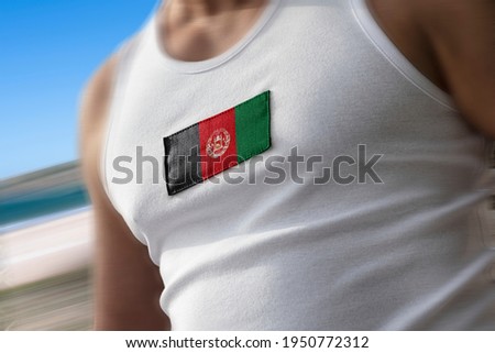 The national flag of Afghanistan on the athlete's chest