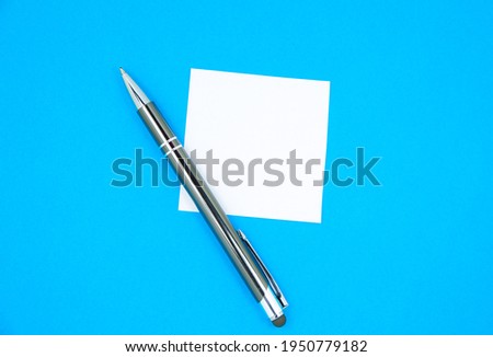 Blank white To Do List Sticker with pen. Searching information on the Internet. Close up of reminder note paper on the blue background. Copy space. Minimalism, original and creative.