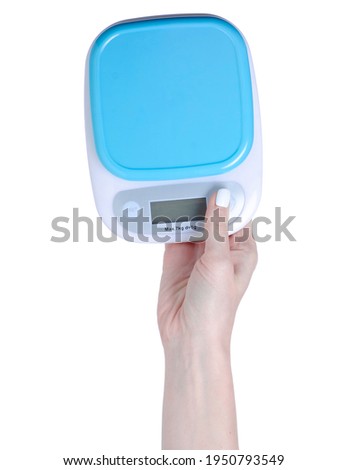 Kitchen scales in hand on white background isolation