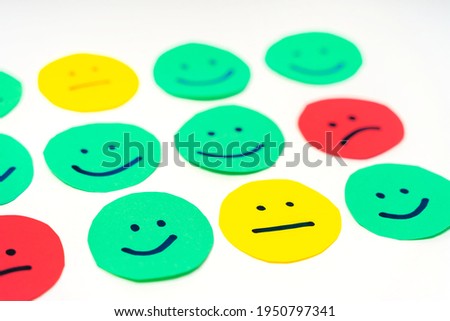 Feedback in the form of faces with emotions of different colors. The concept of a rating scale or sentiment scale Royalty-Free Stock Photo #1950797341
