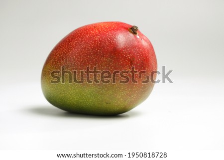 ripe juicy mango on white background