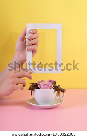 Minimal composition of cigarettes and coffee cups with a white frame. Spring minimum concept. Natural  background  with copy space