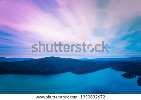 Abstract cloud stacking sunset, blue hour, reflections