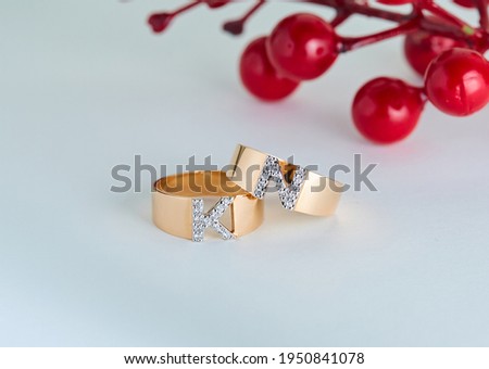 Letter gold diamond ring on a background