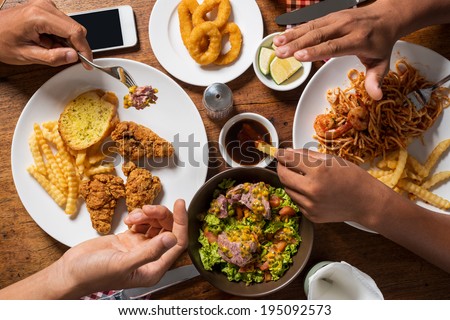 Close-up of two men having their meal together Royalty-Free Stock Photo #195092573