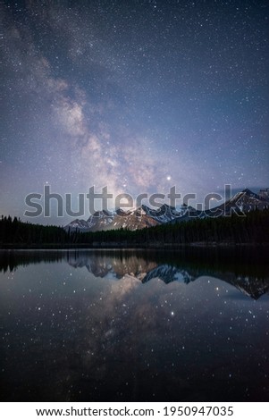 The Milky Way reflecting off of the perfectly still Herbert Lake in Banff National Park.