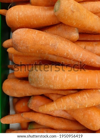 Orange carrot bulbs on display.