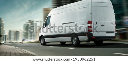 Delivery  van in a city

 Royalty-Free Stock Photo #1950962251