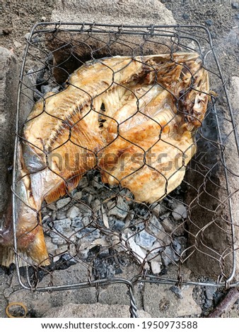grilled fish is a popular side dish in Indonesia. burned in the fireplace for a limited time
