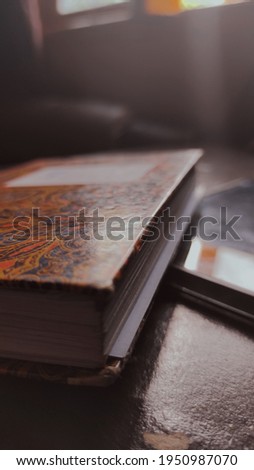 book on the work table in front of the window
