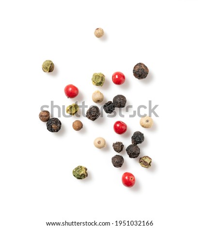 Pepper mix. Black, red, white, and green peppercorns on a white background. View from directly above. Royalty-Free Stock Photo #1951032166