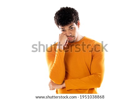 Young black afro man thinking, feeling doubtful and confused, with different options, wondering which decision to make isolated on a white background