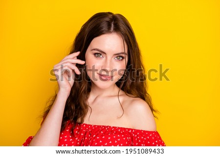 Photo of gorgeous glad lady arm fingers touch play with hair look camera isolated on yellow color background