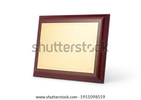 Wood plaque with gold plate isolate on white background.