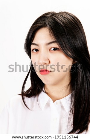 Close-up of a slightly sulky woman's face Royalty-Free Stock Photo #1951156744