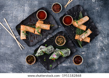 Crispy Chinese Traditional Spring rolls food on set, spring rolls set with copy space background top view, flat lay Royalty-Free Stock Photo #1951182868