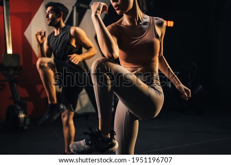 Workout couple people exercise hard squat for good shape body ay gym fitness. Fiem woman squat with trainer fitness by exercise lose weight course, muscle building course. Royalty-Free Stock Photo #1951196707