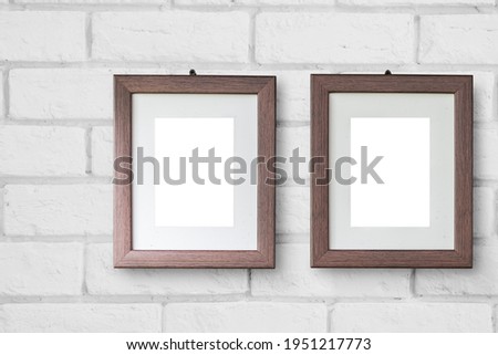 Beautiful two wooden picture frame hanging on white brick wall for couple lover photos minimal simple modern style