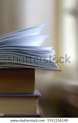 Stack of books on a table. Selective focus.