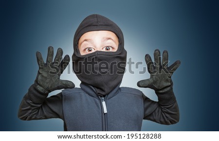 Surprised comic burglar stopped and take his hands up