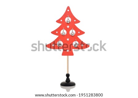 Close up of Red wood Christmas Tree with bells on pole with stand