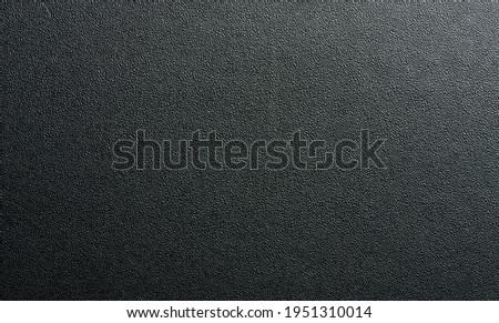 Seamless dark gray leather background pattern macro close up view