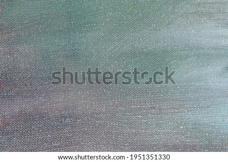 creative background of multi-colored primers on linen canvas surface, toning, temporary object 