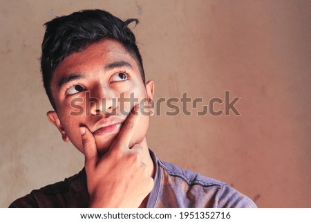 Thoughtful teen boy thinking try solve problem pose isolated background 