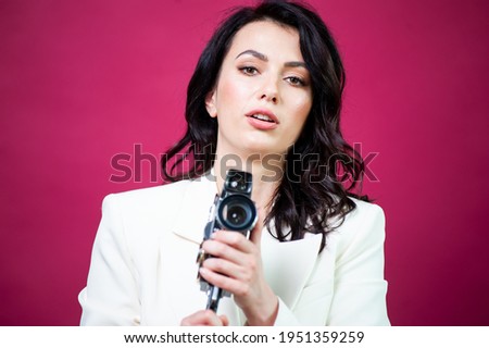 Beautiful woman with photo camera