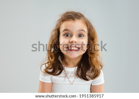 Laughting sincre, smiling. Pretty caucasian girl portrait isolated on white studio background with copyspace. Concept of human emotions, youth, childhood, education, sales, facial expression.
