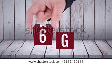 Composition of the word 6g in red cubes being touched by a person. global technology, digital interface, connection and communication concept digitally generated image