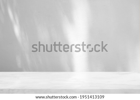 Marble Table with White Stucco Wall Texture Background with Light Beam and Shadow, Suitable for Product Presentation Backdrop, Display, and Mock up.