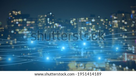 Composition of blue dots and shapes over a cityscape in background. global technology, digital interface, connection and communication concept digitally generated image.