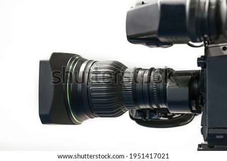 Isolated zoom lens of professional camera, video studio equipmnent. Cinema, clips and reporatge recording technologies