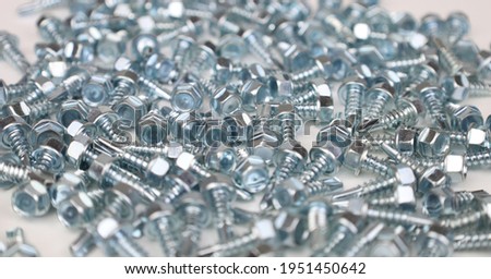 metal screws on white background 