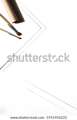 Minimal Design Flatlay with Kraft Paper and Brushes on White Background. Creative Art Design Mockup.