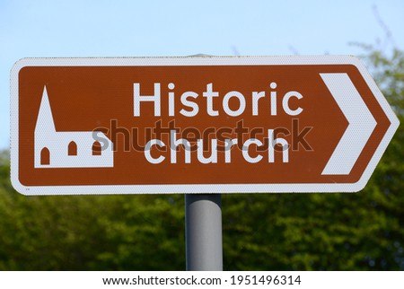 UK Brown Tourist Sign indicating the way to an Historic church, Rickinghall, Suffolk, England, UK - April 2021