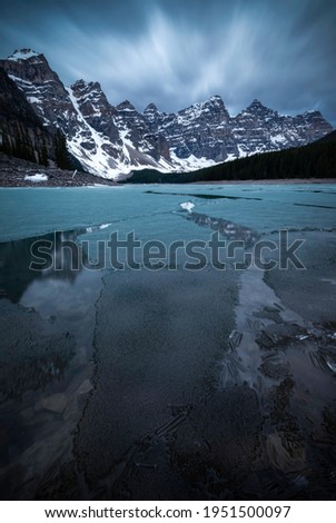 The last of the ice at Moraine Lake breaks apart on an early summer morning in Banff National Park.