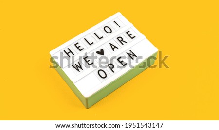 Hello we are open text sign flat lay background, concept and top view photo