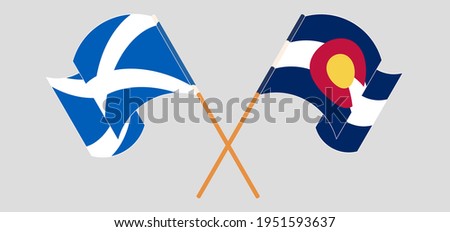 Crossed and waving flags of Scotland and The State of Colorado