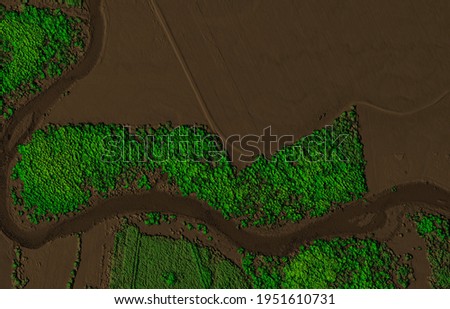 Digital elevation model of a forest area with a river. GIS product made by aerial mapping from a drone. Lidar scan and multispectral camera gives NDVI and NIR effect. Royalty-Free Stock Photo #1951610731